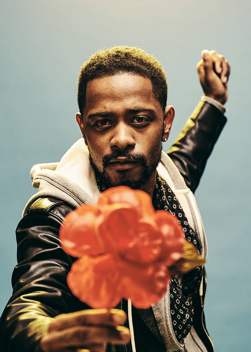 Lakeith Stanfield holding a flower